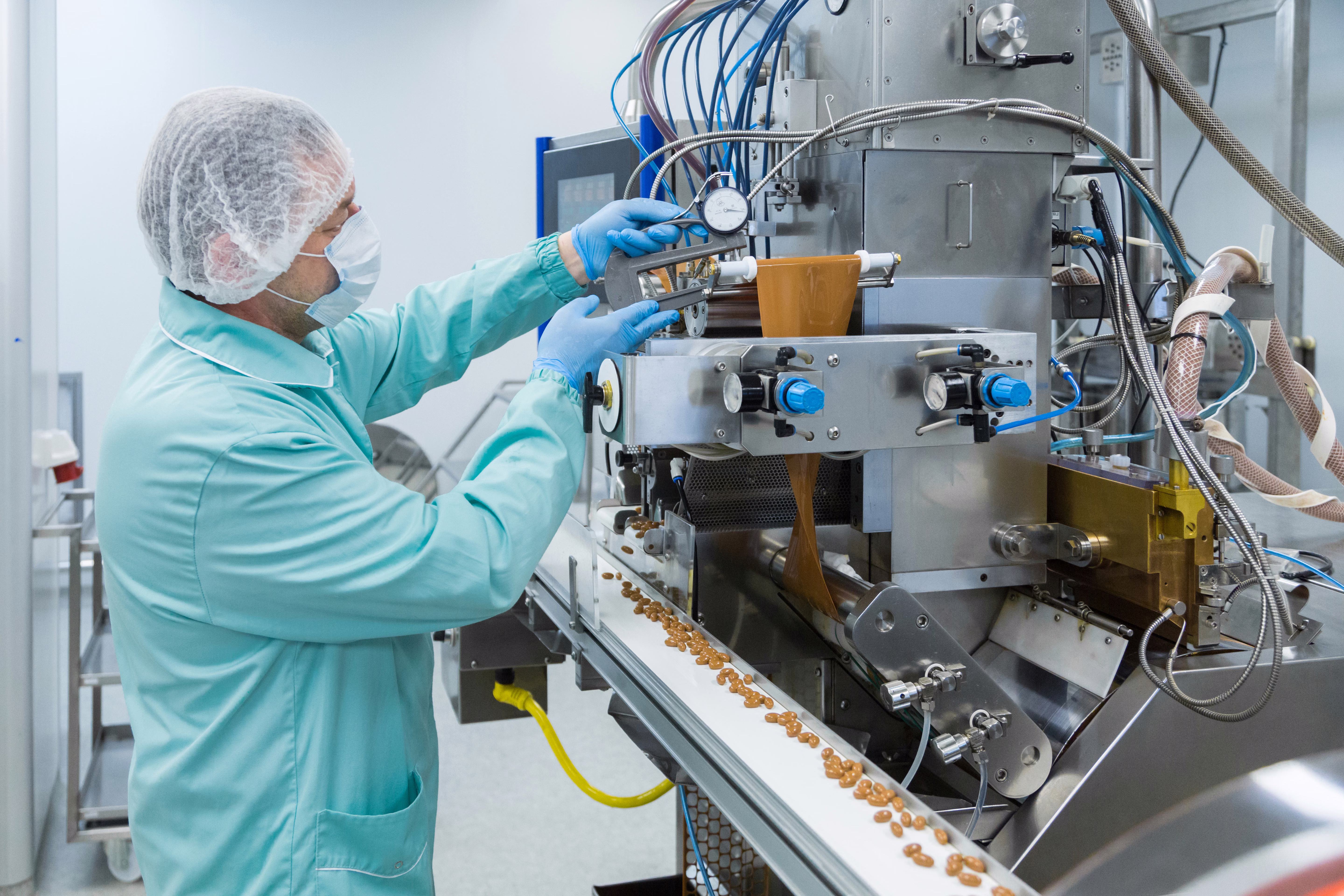 Manufacturing technician operating production equipment